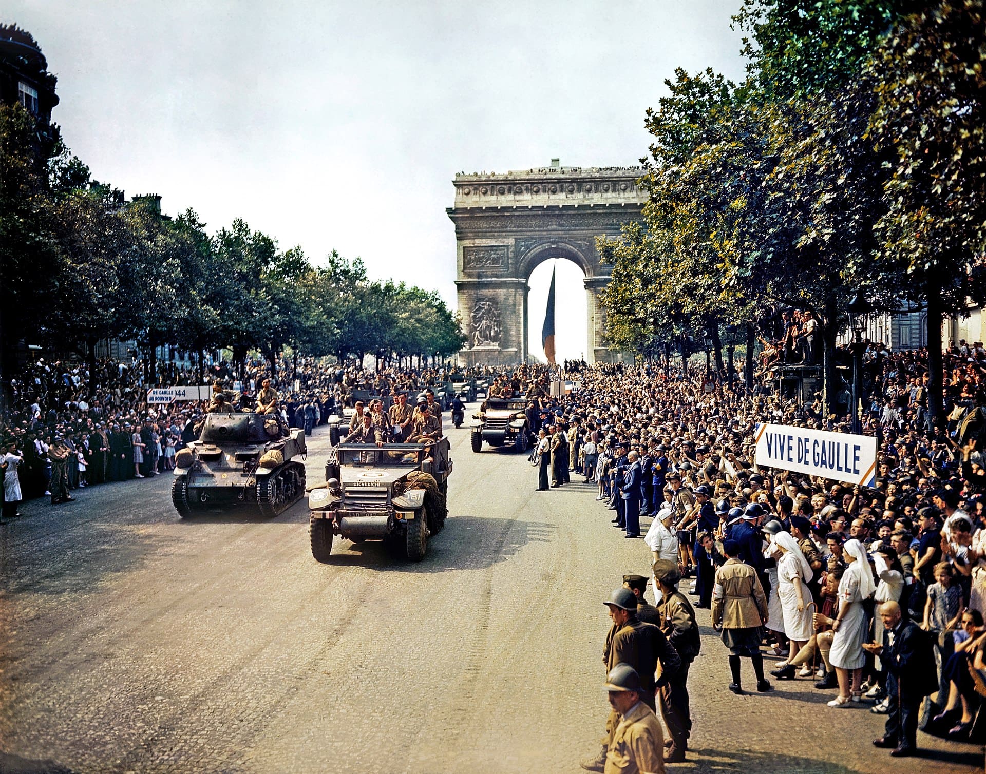The French Second Armored Division of General Philippe Leclerc de Hauteclocque parades on the Champs-Élysées on 26 August, 1944. 